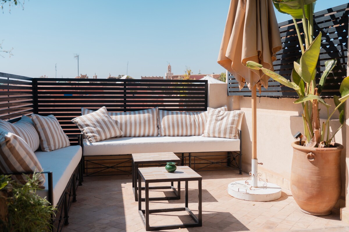 Rooftop terrace with panoramic Marrakech views